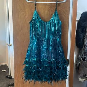 This teal feathers and fringe dress is stunning! Short and sexy